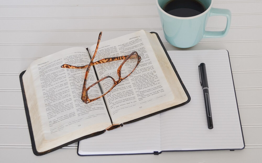 Photo of a Bible, Notebook and Coffee for Bible Study